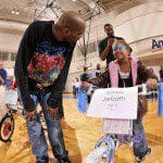 Vince Carter with Sonya Jarbath, who gets a bike