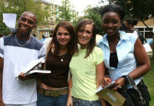 A group of happy students celebrate passing their exams