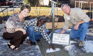 Dee Danmeyer, president and CEO of Habitat for Humanity of Greater Orlando;  Terry Eckert, director of construction for Habitat for Humanity of Greater Orlando; and future Habitat homeowner Gary. 