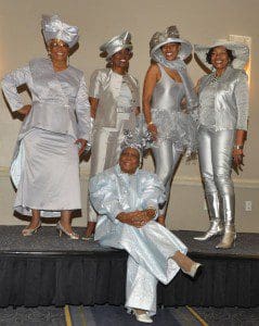 Annie V. Moore, seated, strikes a pose with her “New Jersey Posse.” Orlando native Mrs. Moore, in her 80s, is considered a HATitude faithful. . Photographer/Ted Hollins.