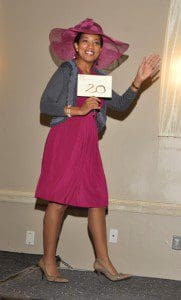 Bridgett Williams, WKMG-TV Orlando news anchor, hits the catwalk in her headgear during the ZORA! Festival 2012 HATitute event. . Photographer/Ted Hollins.