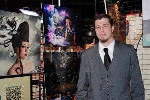 Rich Johnson shows off his art work at 