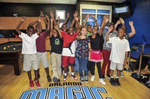 Youth from the Rosemont Community Center on April 23 seeing and experiencing for the first time their new Reading and Learning Center presented by Kia Motors. The center featured new floors and paint, new furniture, a new reading corner, new computer monitors, re-felted pool table, video game accessories and a 47-inch flat screen TV along with books and educational games. Photos taken by Fernando Medina.