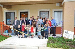 Orange County Commissioner Scott Boyd (extreme left) poses with other community leaders, teachers and kids at the opening of the new UCP of Central Florida campus in Winter Garden, May 1st 2013. (Photo: UCP)
