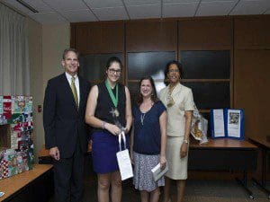 Timber Creek 9th grader Rebecca Imbornoni (second from left) and her teacher Rebecca Green (third from left) are joined by Lockheed Martin Engineering Vice President Jeff Pridmore and Orange County Public Schools Superintendent Dr. Barbara Jenkins.