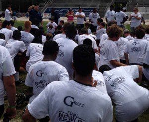 Kids listen attentively to DP coaches during the Youth Football Combine at Bill Spoone Stadium, June 1, 2013 (Photo: WONO)