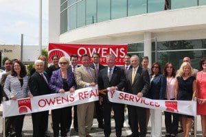 Bob Owens (l) - President/CEO, Owens Realty Services and Orlando Mayor Buddy Dyer (r) cut the ribbon to officially open new headquarters of Owens Realty Services, June 11, 2013. 