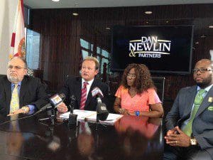 l-r: Attorney Dutch Anderson, Dan Newlin, Alma Fletcher and attorney Jarian Lyons at press conference during which the civil lawsuit filed by  Dan Newlin & Partners was announced, July 31, 2013. (Photo: WONO)