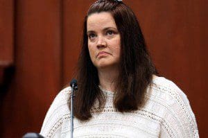 Sondra Osterman, a friend of George Zimmerman, listens to the 911 tape while while on the witness stand at Seminole Circuit Court, in Sanford, Fla., Monday, July 8, 2013. Zimmerman is charged with second-degree murder in the fatal shooting of Trayvon Martin, an unarmed teen, in 2012. (Orlando Sentinel, Joe Burbank, Pool)
