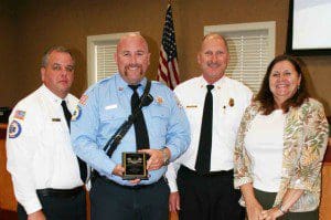 St. Cloud Fire Rescue Assistant Chief William Sturgeon, St. Cloud Fire Rescue Chief Bill Johnston, and St. Cloud Mayor Rebecca Borders congratulate Paramedic/Firefighter Ryan Gallik (second from left) for his selection as the City of St. Cloud June Employee of the Month.