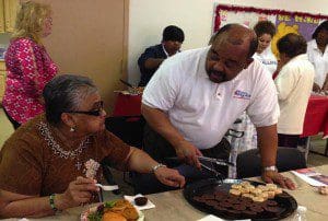 Derrick Wallace, candidate for Orange County Commission, District 6, serves seniors at a Meet & Greet event, William and Catherine Booth Towers, 633 Lake Dot Circle, Orlando, March 5, 2014. (Photo: WONO)