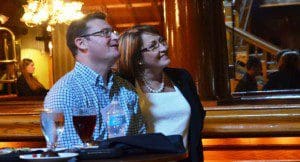 Mayor  Teresa Jacobs and David Glass, publisher of the Florida Technology Journal, watch a screening of the Orlando Rising documentary at the Cheyenne Saloon during the Modeling, Simulation & Training Blue Ribbon Commission tour of the Downtown Technology Entrepreneurship Ecosystem.