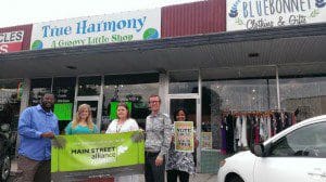 Main Street Alliance staff with Kelly Kubik, owner of the Blue Bonnet