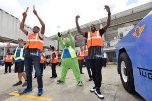 Orlando Magic players Kyle O’Quinn and Tobias Harris “trade places” with Southwest Airlines all-star employees on Feb. 23. The players visited with passengers, signed autographs, took photos, sat in the cockpit and took boarding passes as part of the event.  (Photo credit: Fernando Medina).  