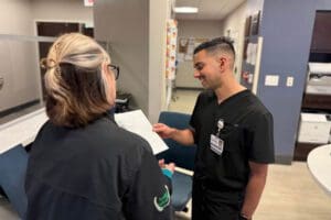 Yousef Hasanzadah, D.O. speaks with nurse at HCA Florida Osceola Hospital
